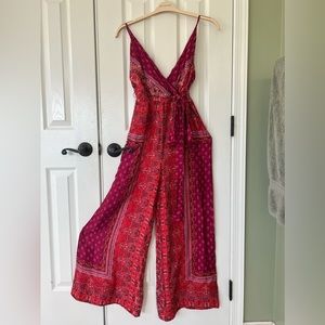 Free People adjustable spaghetti strap jumper. Flowy wide leg pants. Brand new.